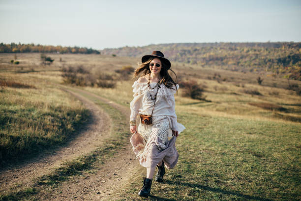 istock Beautiful young boho woman walking on nature 1097744508
