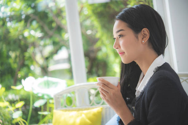 istock Business woman drinking coffee in cafe 1097746574