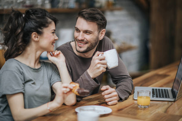 istock Happy couple talking during morning time at home. 1097749378