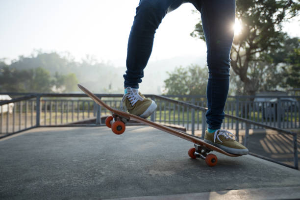 istock Skateboarder skateboarding at skatepark ramp 1097749564