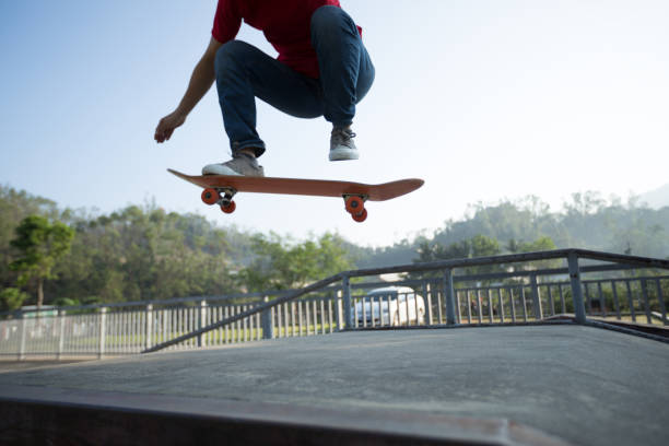 istock Skateboarder skateboarding at skatepark ramp 1097749632