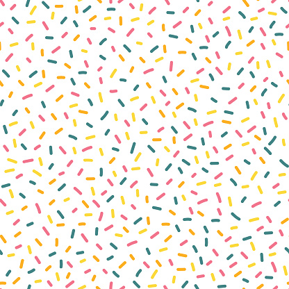 Decorative party sprinkles seamless repeat vector pattern. Blue, yellow, and pink candy kids party decor on white background. Great for birthday, card, invitation, packaging, celebration, kids, bakery