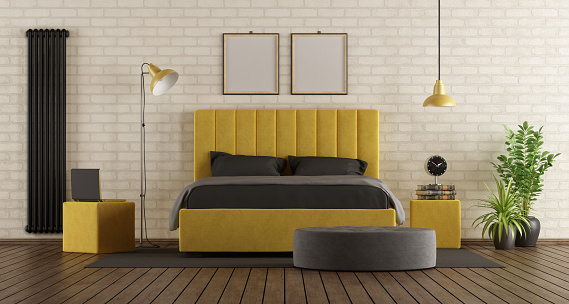 Black and yellow master bedroom with double bed against brick wall - 3d rendering
Note: the room does not exist in reality, Property model is not necessary