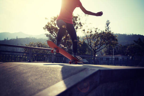 istock Skateboarder skateboarding at skatepark ramp 1097756024