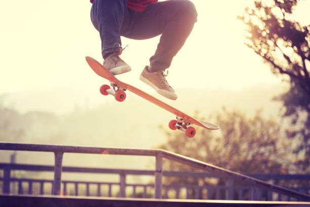 istock Skateboarder skateboarding at skatepark ramp 1097756162