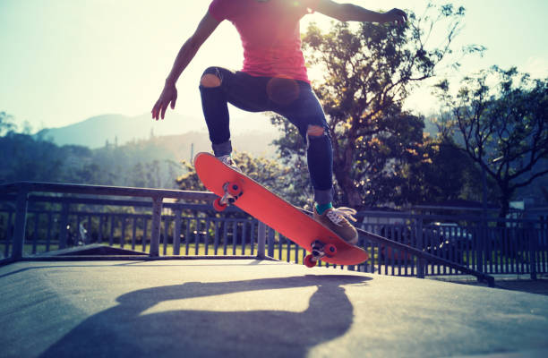 istock Skateboarder skateboarding at skatepark ramp 1097756274