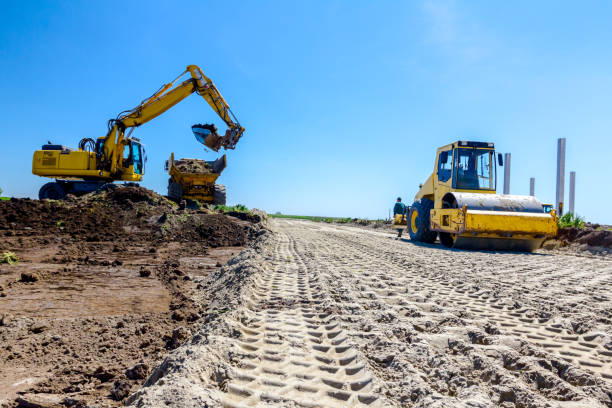 istock Trace of huge road roller with spikes to compact soil at construction site 1097762484