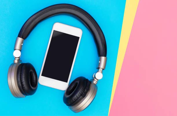 istock Blank Mobile phone screen inside of Golden headphone 1097765182