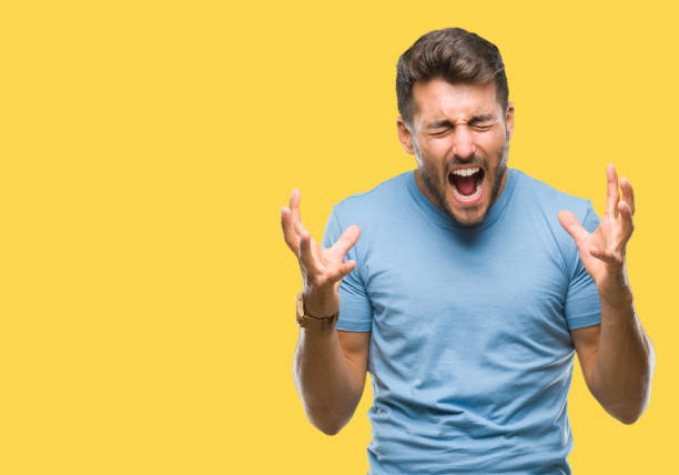 istock Young handsome man over isolated background celebrating crazy and amazed for success with arms raised and open eyes screaming excited. Winner concept 1097766552