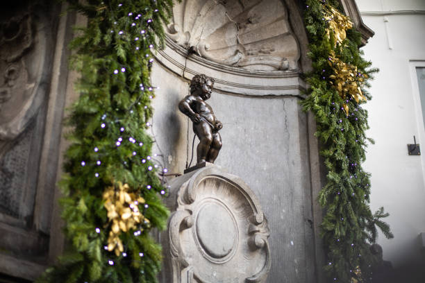 Fountain figure of Manneken Pis in Brussels Fountain figure of Manneken Pis in Brussels manneken pis statue in brussels belgium stock pictures, royalty-free photos & images