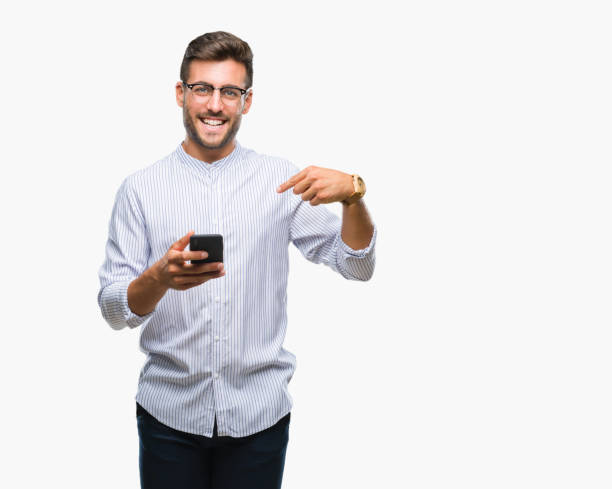 istock Young handsome man texting using smartphone over isolated background with surprise face pointing finger to himself 1097771648