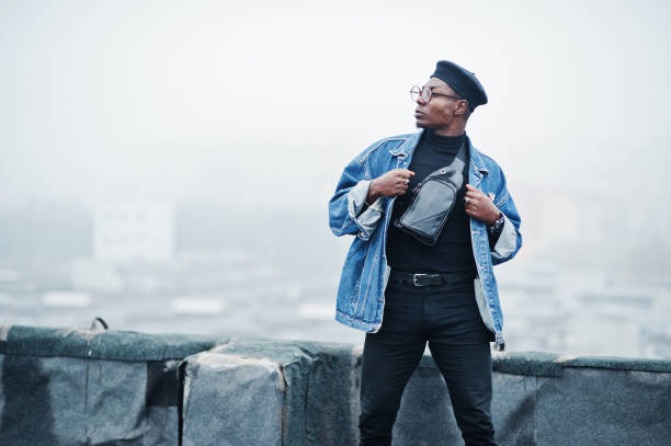 istock African american man in jeans jacket, beret and eyeglasses 1097773116