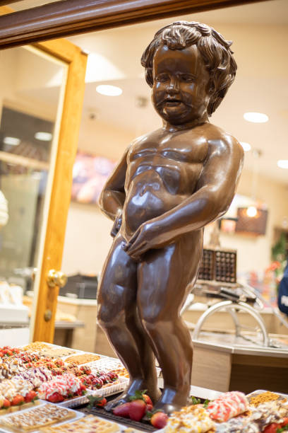 Statue of chocolate of Manneken pis in Brussels, Belgium Statue of chocolate of Manneken pis in Brussels, Belgium manneken pis statue in brussels belgium stock pictures, royalty-free photos & images
