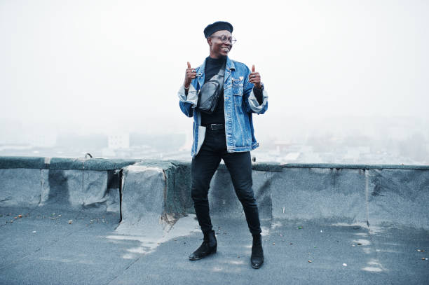 istock African american man in jeans jacket, beret and eyeglasses 1097773184