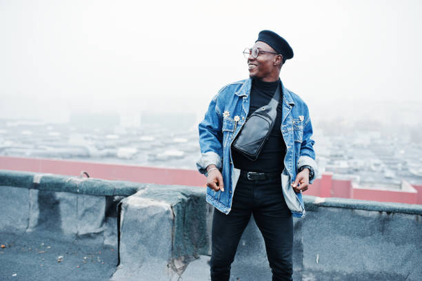 istock African american man in jeans jacket, beret and eyeglasses 1097773238