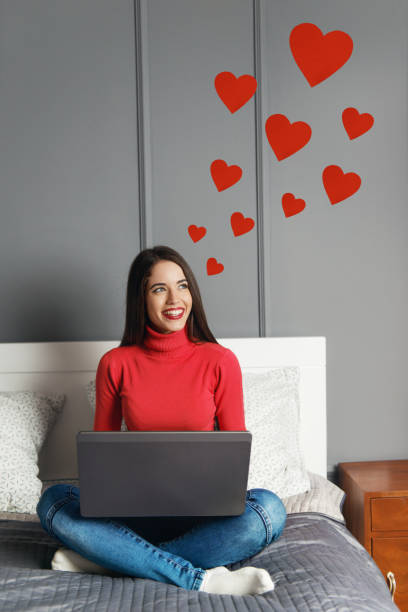 istock Beautiful young woman with red hearts 1097775110