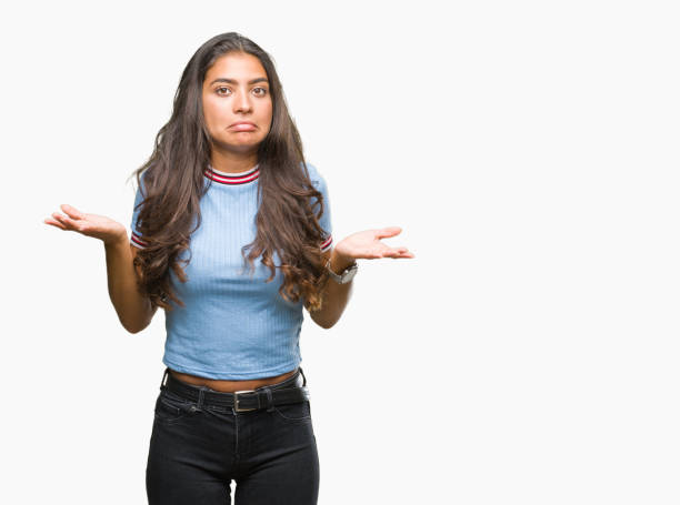 istock Young beautiful arab woman over isolated background clueless and confused expression with arms and hands raised. Doubt concept. 1097775670