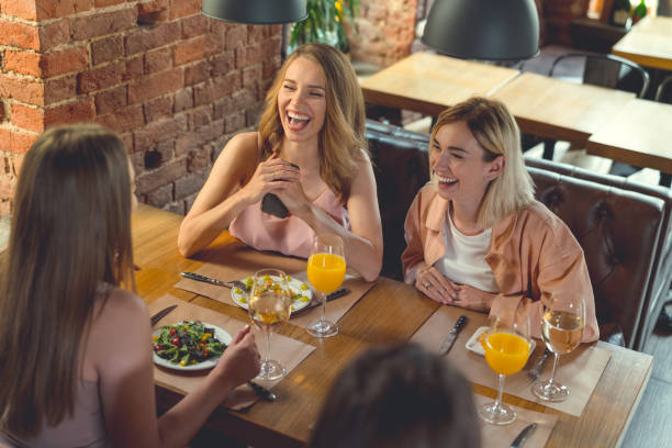 istock Smiling girls in cafe 1097776908