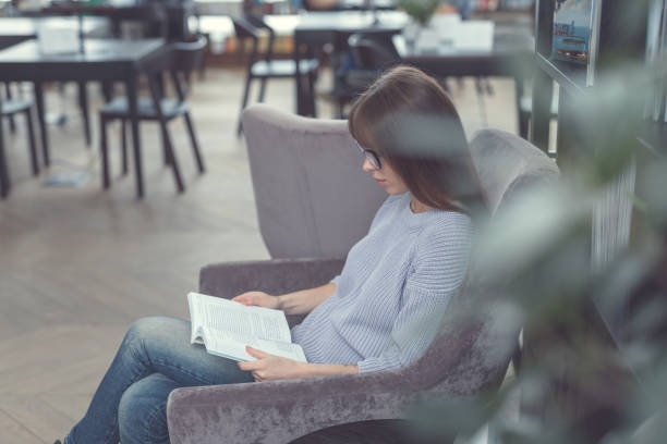 istock Young girl in the library 1097778798