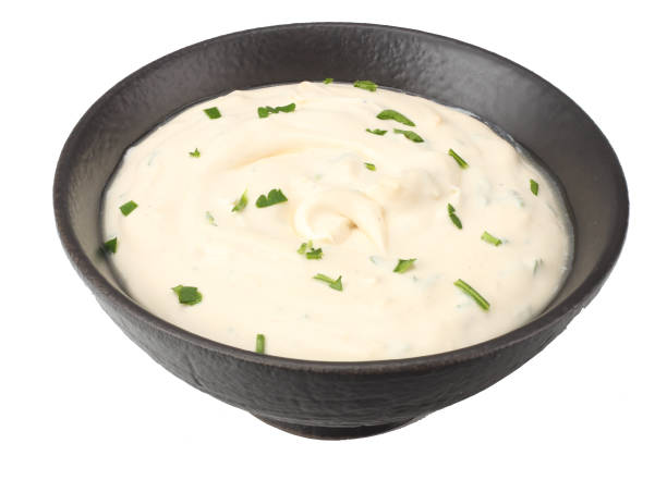 istock garlic sauce in black bowl isolated on white background 1097783452
