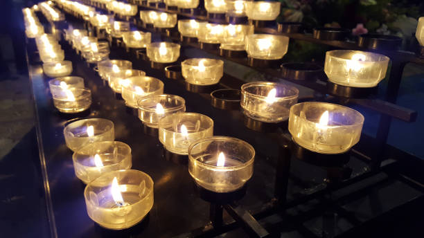 istock burning candles in a church - symbol for mourning, commemoration, devotion 1097783984