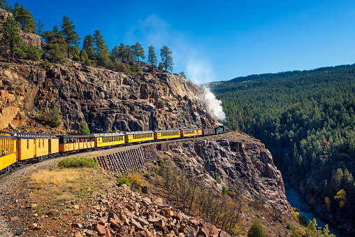 Silverton, Colorado, USA - October 15, 2018 : Tourists ride the historic steam engine train from Durango to Silverton through the San Juan Mountains in Colorado, USA.