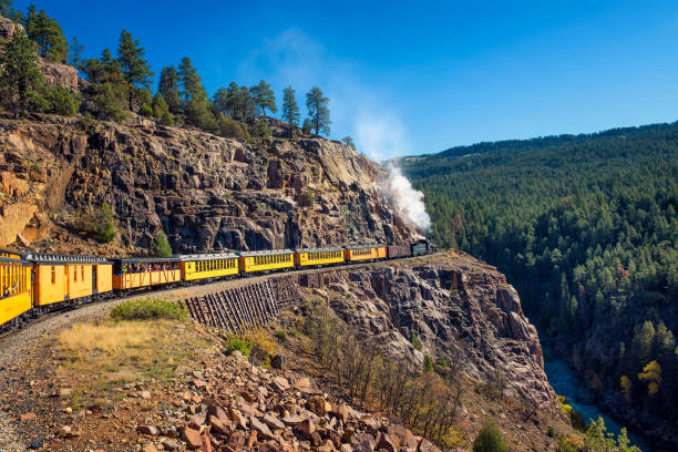 Tourists ride the historic steam engine train in Colorado, USA stock photo