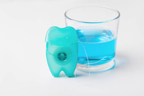 istock Dental floss on a blue background. 1097789390
