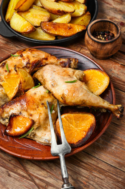 istock Baked chicken pieces in orange sauce 1097789630