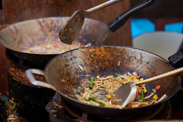 istock Cooking Pad Thai Goong Sod in pan, Fried noodle Thai style with prawns. 1097789970