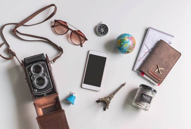 istock Empty screen smart phone with travel accessories and items on white background with copy space, Travel concept 1097793208