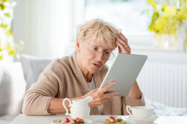 istock Worried senior woman using digital tablet 1097795988