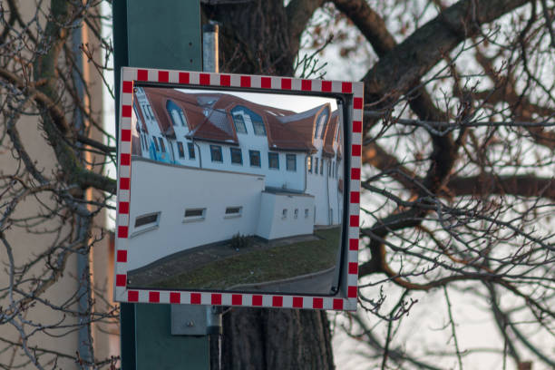 istock Houses front in a traffic mirror 1097799536
