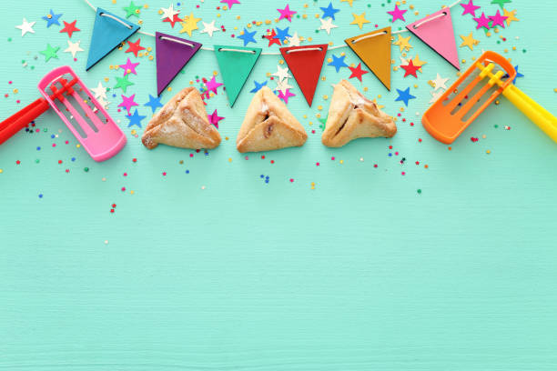 istock Purim celebration concept (jewish carnival holiday) over wooden mint background. 1097800034