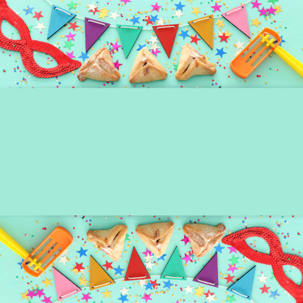 istock Purim celebration concept (jewish carnival holiday) over wooden mint background. 1097800042