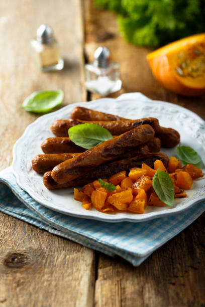 Grilled sausages Grilled sausages with roasted pumpkin turkish sausage stock pictures, royalty-free photos & images