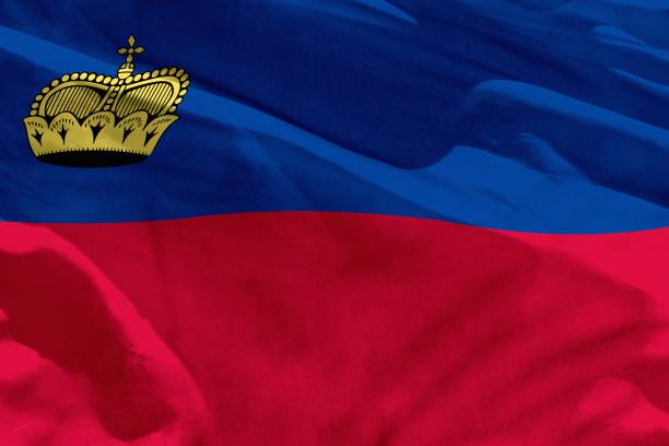 istock Waving Liechtenstein flag for using as texture or background, the flag is fluttering on the wind 1097800184