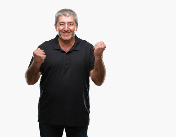 istock Handsome senior man over isolated background very happy and excited doing winner gesture with arms raised, smiling and screaming for success. Celebration concept. 1097802312