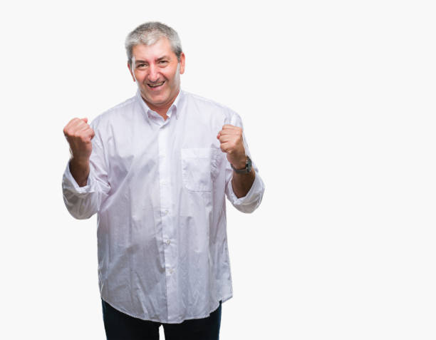 istock Handsome senior man over isolated background very happy and excited doing winner gesture with arms raised, smiling and screaming for success. Celebration concept. 1097802706