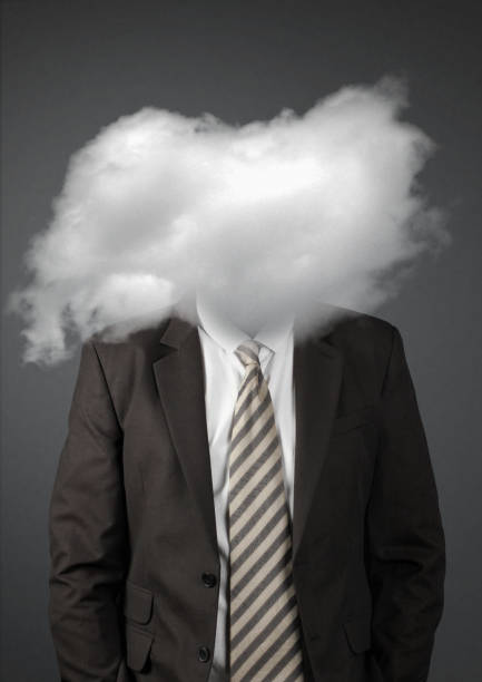 istock Faceless businessman with head in clouds 1097803020