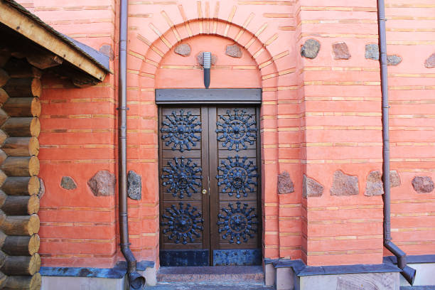 istock Old metal door in a brick castle. 1097803030