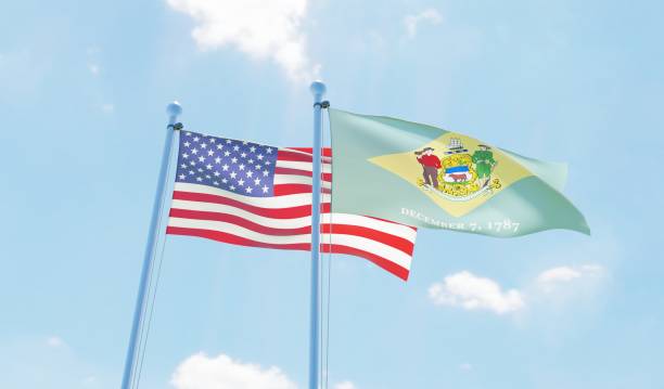 istock USA and state Delaware, two flags waving against blue sky 1097803368