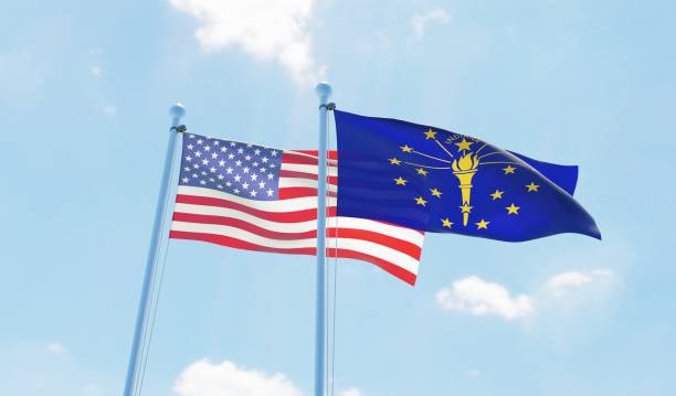 istock USA and state Indiana, two flags waving against blue sky 1097803538