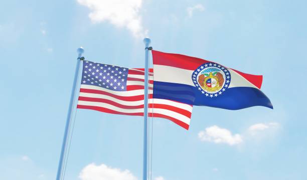 istock USA and state Missouri, two flags waving against blue sky 1097803812
