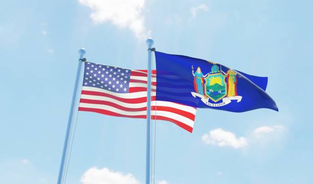 istock USA and state New York, two flags waving against blue sky 1097803924