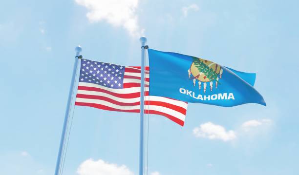 USA and state Oklahoma, two flags waving against blue sky. 3d image