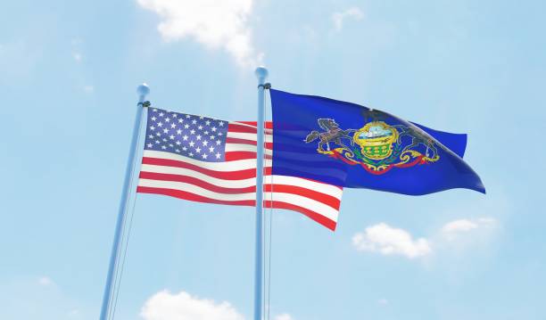 istock USA and state Pennsylvania, two flags waving against blue sky 1097804116