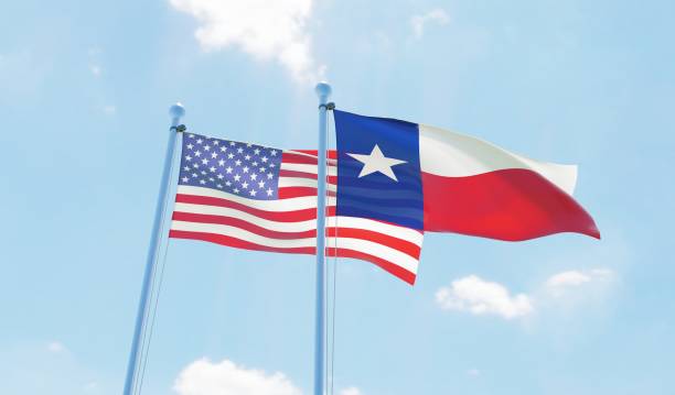 istock USA and state Texas, two flags waving against blue sky 1097804186