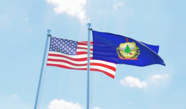 istock USA and state Vermont, two flags waving against blue sky 1097804252