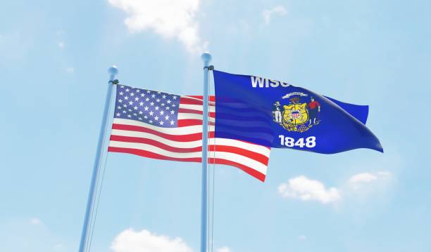 istock USA and state Wisconsin, two flags waving against blue sky 1097804338